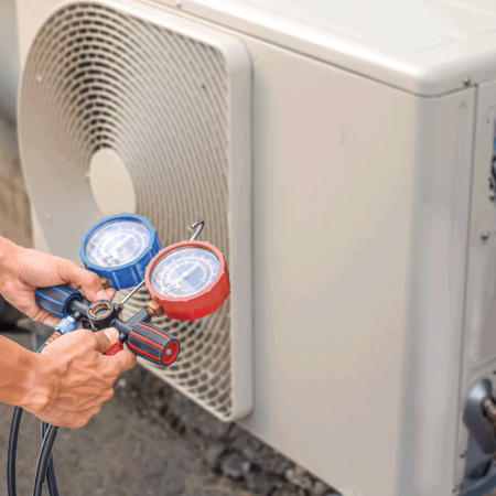 Technician-checking-the-operation-of-the-air-conditioner-using-tool-with-high-and-low-pressure.-How-To-Recover-Freon-Without-A-Machine